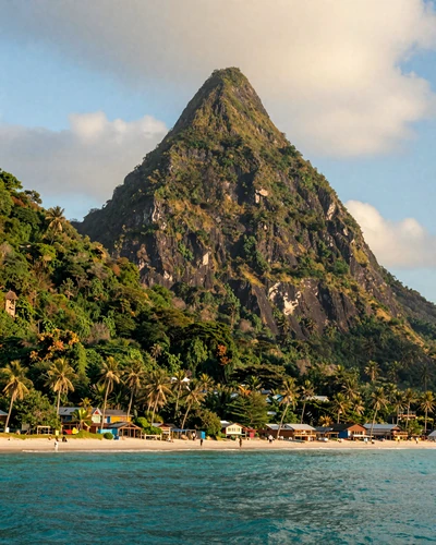 The iconic twin Pitons mountains of Saint Lucia rising from turquoise Caribbean waters with lush tropical vegetation