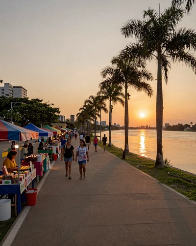 Asunción riverside Costanera promenade at golden hour with palm trees and the Paraguay River